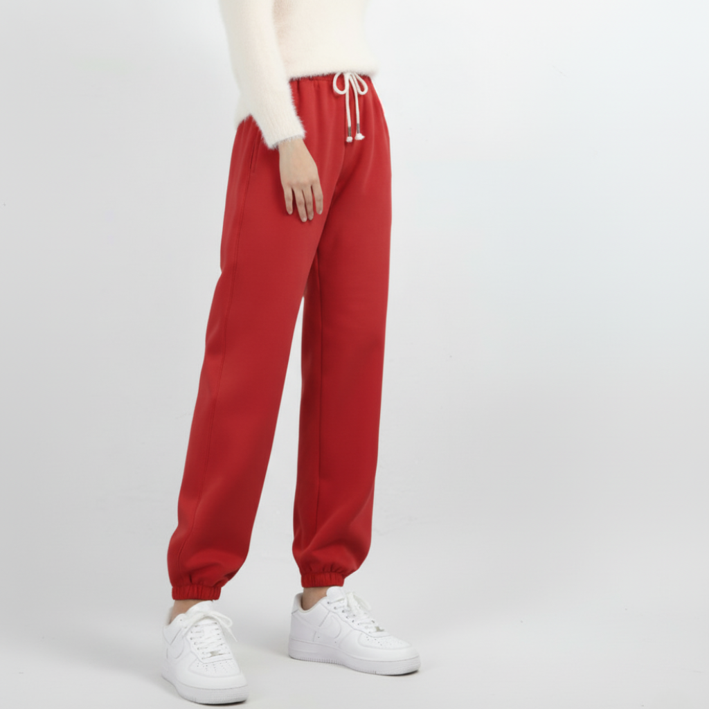 Te eleganckie i wygodne damskie spodnie dresowe o swobodnym kroju są wykonane z grubej wełnianej tkaniny i idealnie nadają się do noszenia jesienią i zimą.